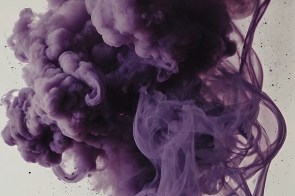 Collection of colorful e-liquid bottles in various flavors